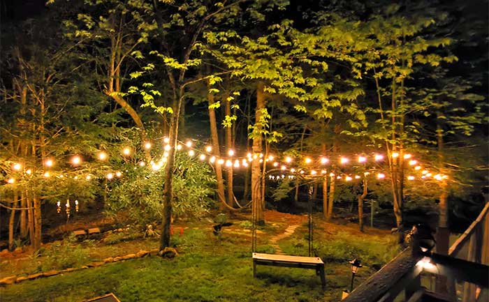 emerald lakes yard at night with strung lights
