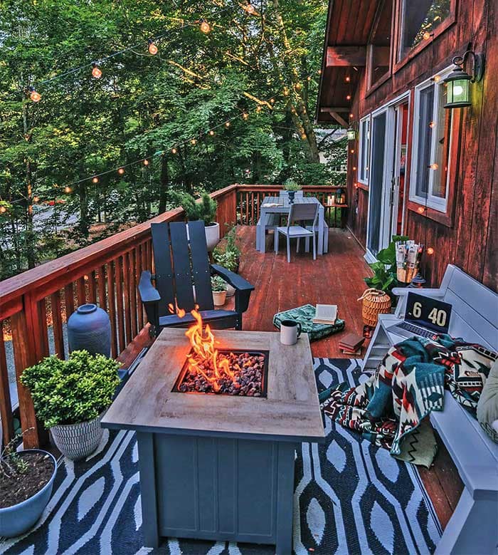 the green light lodge deck with firepit