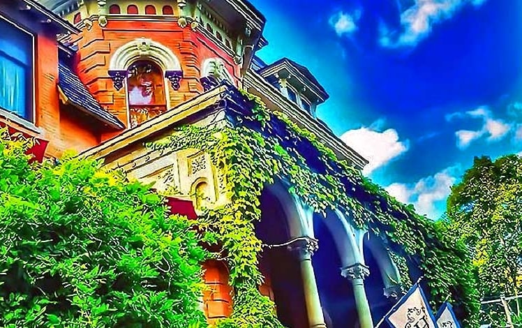 harry packer mansion front porch covered in ivy