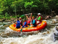 Jim Thorpe River Adventures people in raft on the river