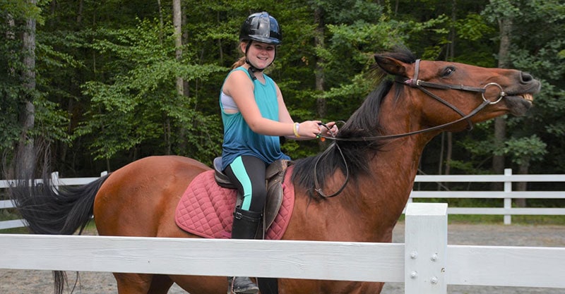 lake-greeley-camp-girl-on-horseback