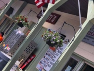 lake harmony country store exterior with flags and hanging flower baskets