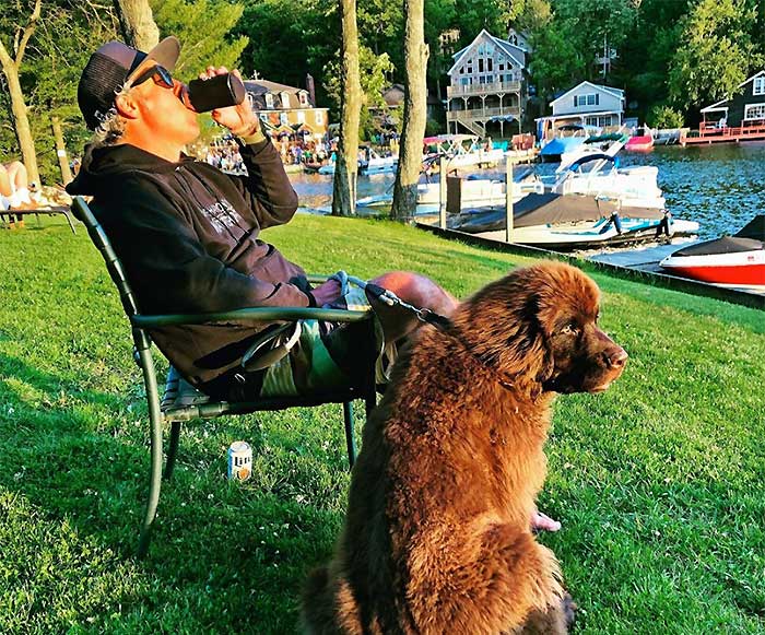lake harmony watersports guy on shore with dog