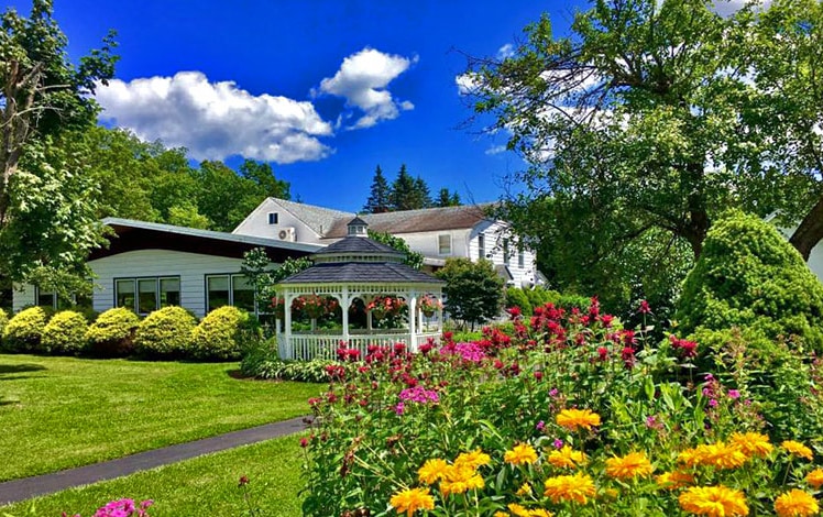 Lukan's Farm Resort main building and flower garden