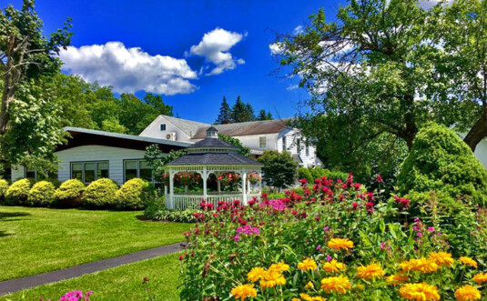 Lukan's Farm Resort main building and flower garden