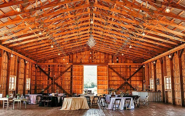 barn interior with reception tables
