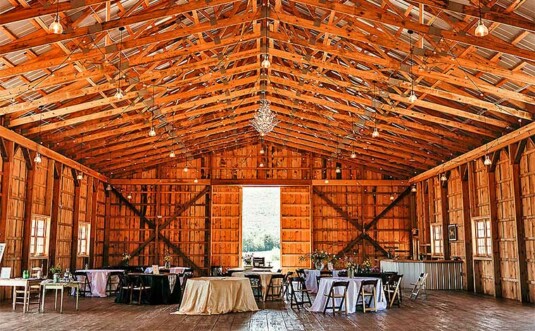 barn interior with reception tables