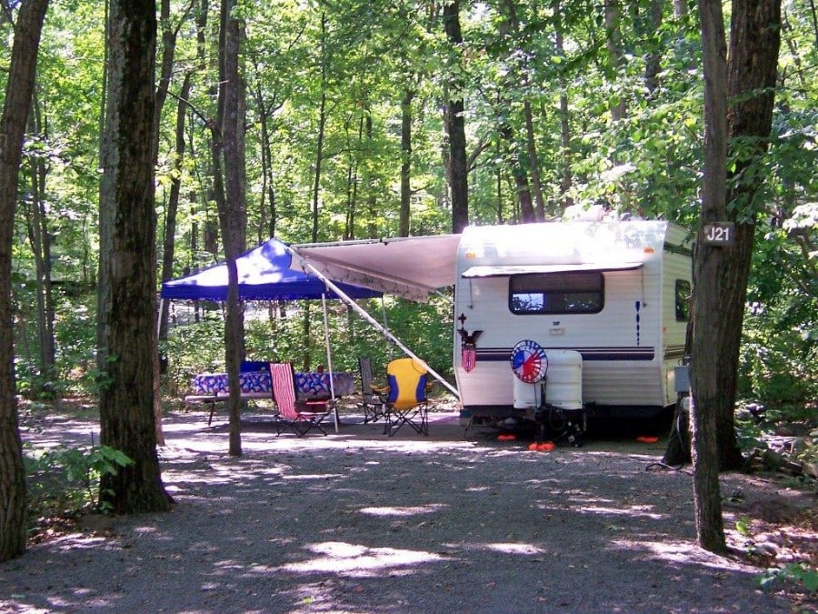 otter lake resort camper on wooded site