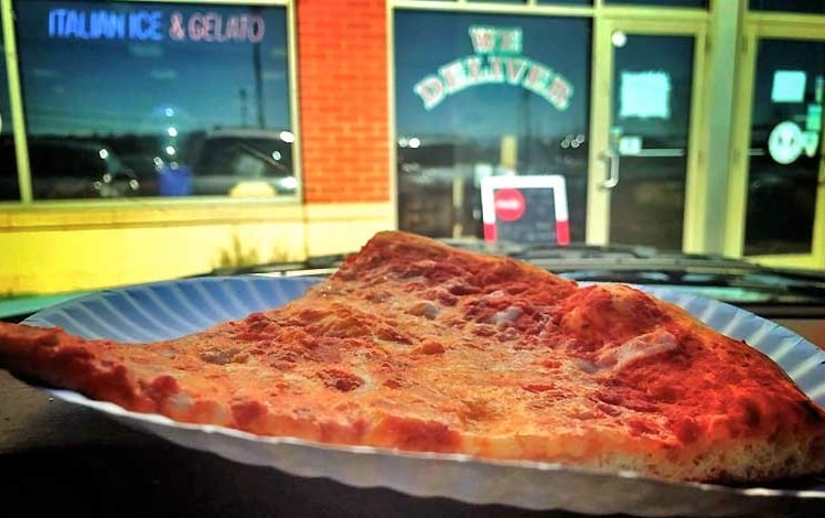 palumbo's pizza II slice in front of building exterior