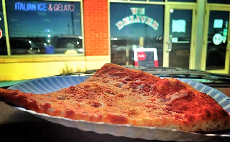 palumbo's pizza II slice in front of building exterior