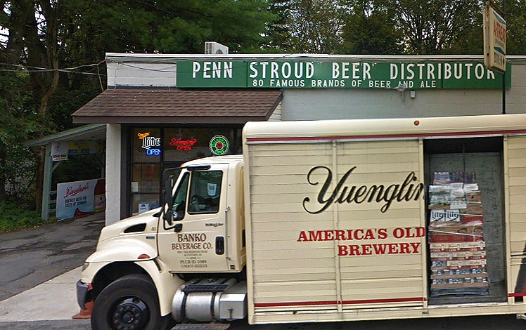 Penn Strouds Beer exterior store with Yuengling truck parked out front