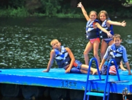 Perlman Camp kids on the dock on the lake