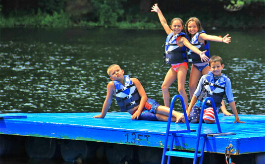 Perlman Camp kids on the dock on the lake