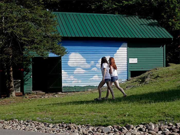 pine-forest-camp-girls-walking