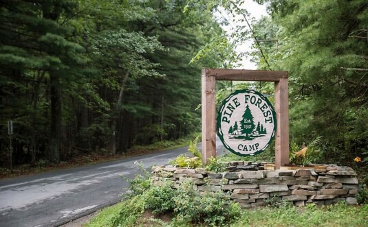 pine forest camp-weddings entrance sign