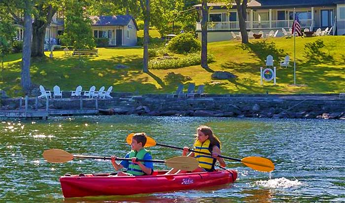 silver birches resort kids kayaking on the lake