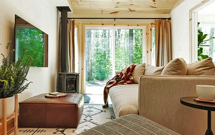 living room with fireplace overlooking the park