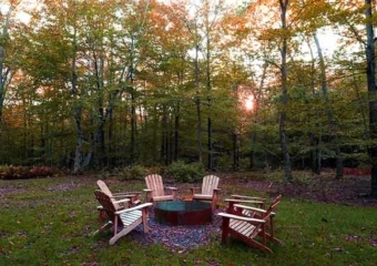 The tree house fire pit and chairs