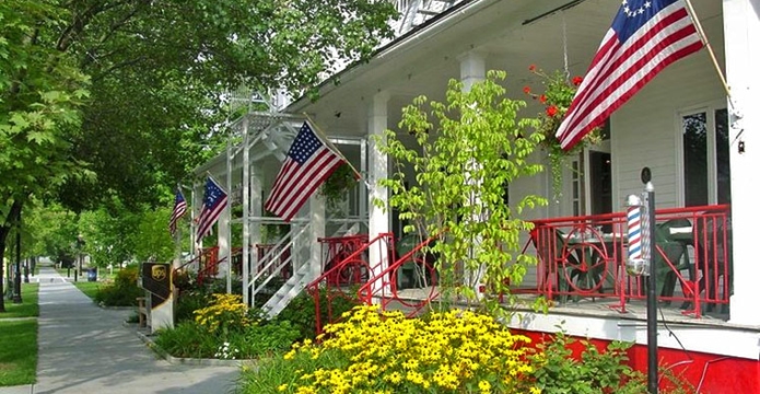 front porch and treed sidewalk