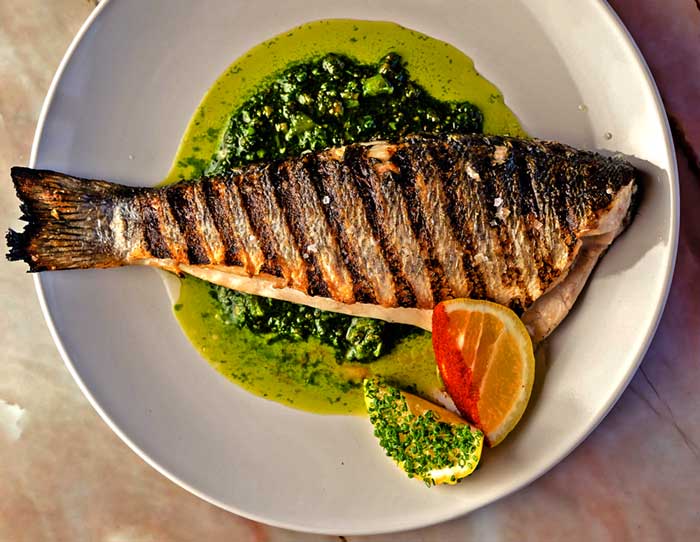 Tom Quick Inn Restaurant plate with whole fish in sauce