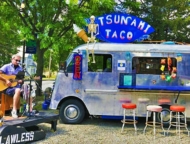 Tsunami Taco Truck with musician performing next to it