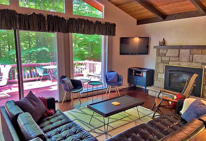 two pines camp living room and deck