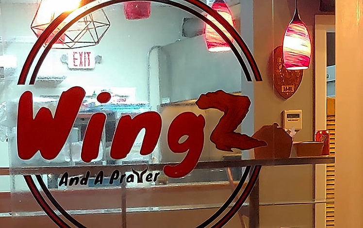 wingz and a prayer front window