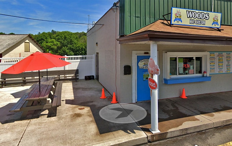 Woods Ice Cream in White Haven exterior and picnic tables with umbrellas